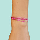 Model wearing Pura Vida Cross My Heart Bracelet