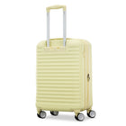 A pale yellow hard-shell spinner suitcase with a telescopic handle extended, shown on a clean white background.