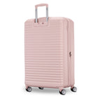 Pink suitcase with a ribbed texture on a white background