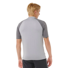 Person wearing a gray athletic shirt with a white background
