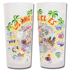 Two white tumblers with colorful Los Angeles-themed illustrations on a white background