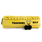 Plush toy shaped like a ruler with a face, labeled 'Teachers Rule', on a white background