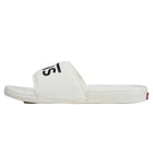 A white slide sandal with a black FILA logo on the strap, shown in a side profile view against a white background.