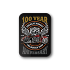 A rectangular black magnet with rounded corners featuring a vintage Route 66 motorcycle graphic and the text '100 YEAR ANNIVERSARY' on a white background.
