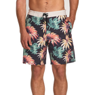 Tropical floral patterned shorts worn by a person on a white background