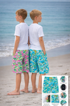 Two boys standing on a beach wearing colorful shorts with a inset showing different patterns.