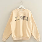 Beige sweatshirt with 'CALIFORNIA' text on a hanger against a plain background
