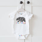 White baby onesie with bear design and 'California' text on a hanger against a white background