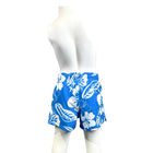 Blue shorts with white floral pattern on a mannequin against a white background