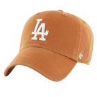 A burnt orange baseball cap featuring a white embroidered 'LA' logo on the front and a white '47' logo on the side, set against a plain white background.