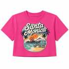 A bright pink short-sleeve crop top t-shirt featuring a retro-style 'Santa Monica California' graphic print on the front, displayed against a clean white background.