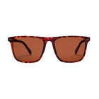 Sunglasses with tortoiseshell frame and brown lenses on a white background