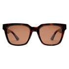Sunglasses with tortoiseshell frame and brown lenses on a white background