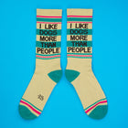 Beige socks with text 'I Like Dogs More Than People' on a blue background