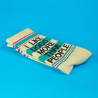 Stack of socks with text 'I like dogs more than people' on a blue background
