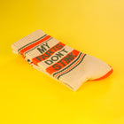 Sock with 'My Farts Don't Stink' text on a yellow background