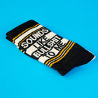 Black and white sock with text on a blue background
