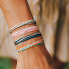 Model wearing Pura Vida Bubble Gum Bracelet