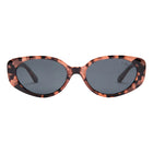Sunglasses with tortoiseshell frame and dark lenses on a white background