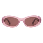 Pink sunglasses with brown lenses on a white background