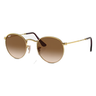 Gold-framed sunglasses with brown gradient lenses on a white background