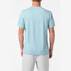 Person wearing a light blue t-shirt on a white background
