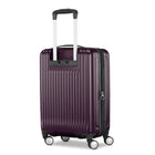 A hard-shell spinner suitcase in deep purple with a ribbed vertical design, featuring a telescoping silver handle and four wheels, shown on a plain white background.