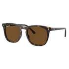 Ray-Ban sunglasses with a dark brown and black tortoiseshell acetate frame and brown lenses, shown on a light gray background with a soft reflection.