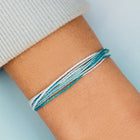 model wearing Pura Vida Coastal Way Bracelet
