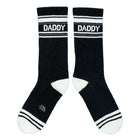 Black socks with 'DADDY' text on a blue background