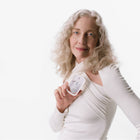 Model holding Rainwater Power Mist Hydrating Hand Sanitizer