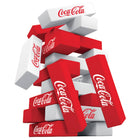 Stack of red and white Coca-Cola boxes on a white background