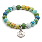 Colorful beaded bracelet with a silver charm on a white background Friend Bracelet
