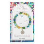 Colorful beaded bracelet with a silver charm on a decorative card, featuring text and JILZARAH branding.