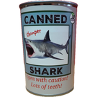 Canned shark product with humorous label on a white background