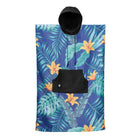 Hooded towel with tropical leaf and flower pattern on a blue background