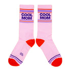 Pink socks with 'Cool Mom' text on a yellow background