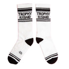 White socks with 'Trophy Husband' text on a pink background