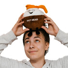 Person wearing a plush toy shaped like a coffee cup with a face and 'Pot Head' text on a white background