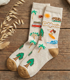 Pair of socks with California-themed designs on a wooden surface