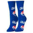 A pair of royal blue crew socks featuring the Pepsi logo printed in white and red, shown against a plain white background.
