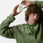 Model holding Aloe You Power Mist Hydrating Hand Sanitizer