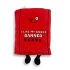 Red plush toy shaped like a book with text 'I Like My Books Banned' on a white background