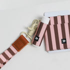 Striped wallet and keychain set with visible brand logo on a light background