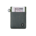 A slim cardholder wallet in textured olive green with a topographic contour pattern, featuring a black logo patch on the front and a silver keyring loop on the side. A single dollar bill is partially inserted into the card slots.