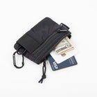 Black wallet with money and card on a white background