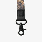Close-up of a camouflage strap with a black clasp on a white background