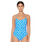 Woman wearing a blue floral swimsuit on a white background