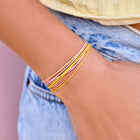 Model wearing Pura Vida Blushing Lemonade Bracelet