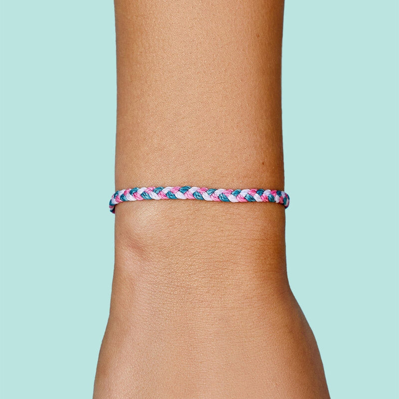 Model wearing Pura Vida Multi Mini Braided Bracelet - Kauai Sunrise